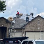 Roof replacement work by professionals on a residential home in Austin TX.